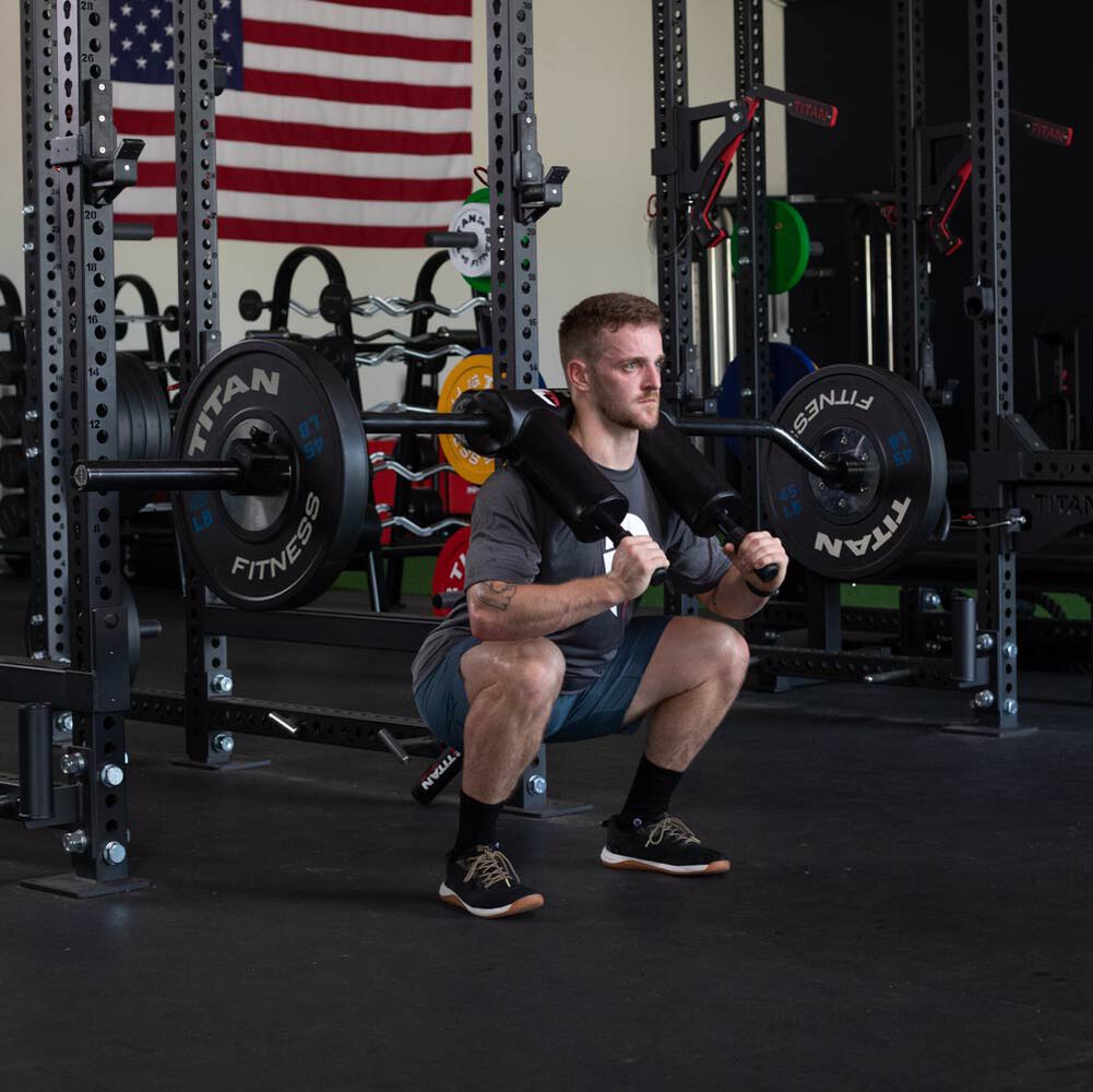 Safety Squat Olympic Bar - USA Made with American Steel - Built-In Foam Pad  | Titan Fitness